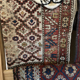 Vintage throw rug with animal detail