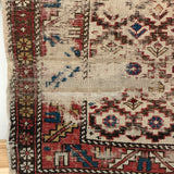 Vintage throw rug with animal detail