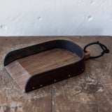 The Child's Leather and Wood Dustpan